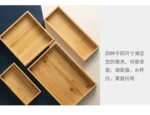 Elegant bamboo serving tray with Japanese-style square design, perfect for serving tea or fruit