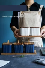 Ceramic kitchen storage container set with matte striped design and spoon