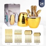 Gold flatware set with spoon, fork, and steak knife on a white tablecloth