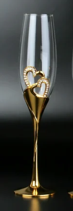 Elegant crystal champagne glasses set on a table with sparkling wine