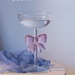 Elegant pink bow glass cup with heat-resistant borosilicate glass, perfect for champagne and cold drinks