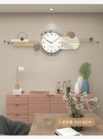Silent clock with a metallic rim catching light in a sunlit room with plants.