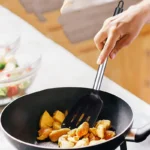 Goldoma silicone spatula set with two heat-resistant spatulas on a nonstick pan