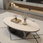 Modern coffee table with sintered stone top in black frame and bright fish belly white finish, rectangular shape