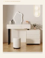 Modern wooden makeup vanity table with mirror and matching stool, featuring a storage drawer for organization