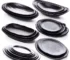 Black melamine dinner plates stacked elegantly on a wooden table