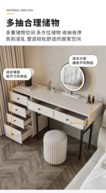 Modern minimalist makeup vanity table with mirror and stool in a bedroom setting