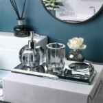 Lotion bottle with pump, on glass shelf.