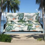 Outdoor bench cushion on a wooden garden bench with vibrant floral pattern