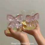 Elegant pink bow glass cup with heat-resistant borosilicate glass, perfect for champagne and cold drinks