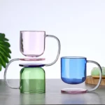 Colorful borosilicate glass drinking glasses on a wooden table