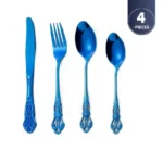 Gold flatware set with spoon, fork, and steak knife on a white tablecloth