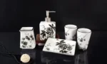 Close-up of the soap dish's drainage slots and the blue floral pattern on the rim.
