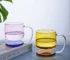 Colorful borosilicate glass drinking glasses on a wooden table