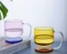Colorful borosilicate glass drinking glasses on a wooden table