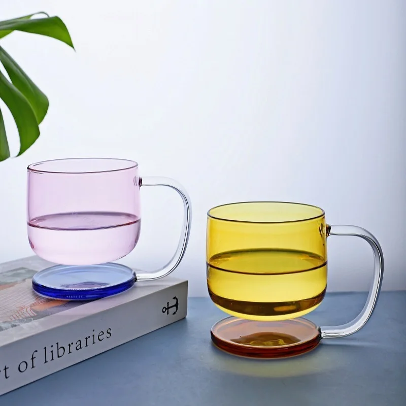Colorful borosilicate glass drinking glasses on a wooden table