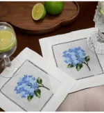 White linen cloth napkins hemstitched cocktail napkins set of 100 on wooden table