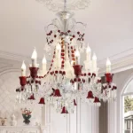 Modern red crystal chandelier with clear red K9 crystals hanging in a living room