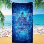Blue star turtle quick dry beach towel on sand with ocean background