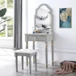Modern white dressing table with mirror and stool in a bedroom setting