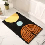 Modern abstract art non slip bathroom rug with vibrant colors and textured surface on a bathroom floor