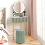 Marble top dressing table with lighted mirror and stool in a bedroom setting