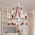 Modern red crystal chandelier with clear red K9 crystals hanging in a living room