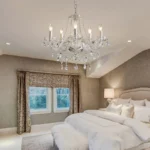 Elegant crystal chandelier illuminating a modern living room with sparkling light