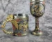Mechanical dragon beer stein with intricate scale texture and dragon head handle on a dark table