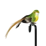 Multi-colored foam birds clustered on a tree branch, mimicking a lively garden scene during daytime.