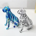 Side view of the resin boxer dog with colorful paint splatters.