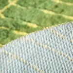 Soft absorbent bath mat in bathroom with banana leaf texture