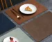 Genuine cowhide table mats on a dining table with elegant dinnerware