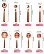Set of stainless steel measuring cups with copper and rose gold finishes on wooden stand
