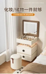 Modern lifting vanity table with mirror in cream finish, featuring rotating top and adjustable height for bedroom use