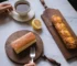Elegant walnut cutting board with French vintage design, perfect for bread, cheese, and fruit presentation