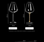 Elegant crystal wine glass set on a wooden table with soft lighting