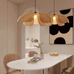 Handwoven rattan ceiling light in a modern dining room setting