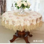 Elegant lace tablecloth with rose gold embroidery on a dining table