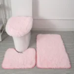 Plush bathroom rug set with toilet lid cover and mat in a modern bathroom