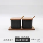 Ceramic kitchen storage container set with matte striped design and spoon