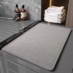 Quick dry bath mat with braided chenille texture in a modern bathroom