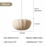Wabi sabi pendant light hanging over a wooden dining table in a cozy room