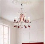 Modern red crystal chandelier with clear red K9 crystals hanging in a living room