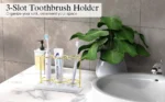 Resin toothbrush holder with a razor and toothbrushes on a wooden bathroom shelf.