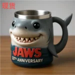 Jaws 50th Anniversary 3D shark mug on a wooden table with coffee