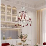 Modern red crystal chandelier with clear red K9 crystals hanging in a living room