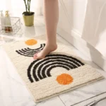 Modern abstract art non slip bathroom rug with vibrant colors and textured surface on a bathroom floor