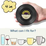 Set of vinyl record coasters on a wooden table
