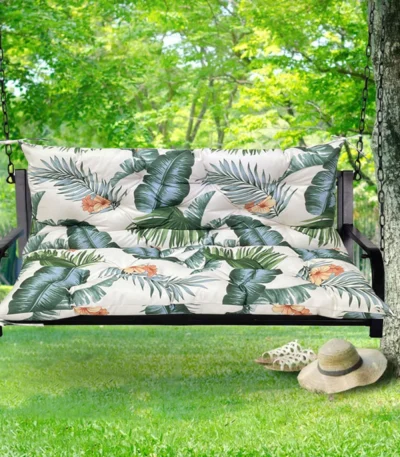 Outdoor bench cushion on a wooden garden bench with vibrant floral pattern